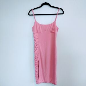 Luvalot pink bodycon dress with rushed side and slit on the side.  Spaghetti str